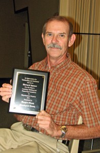 Howard Spence displaying the plaque of appreciation from BCGS