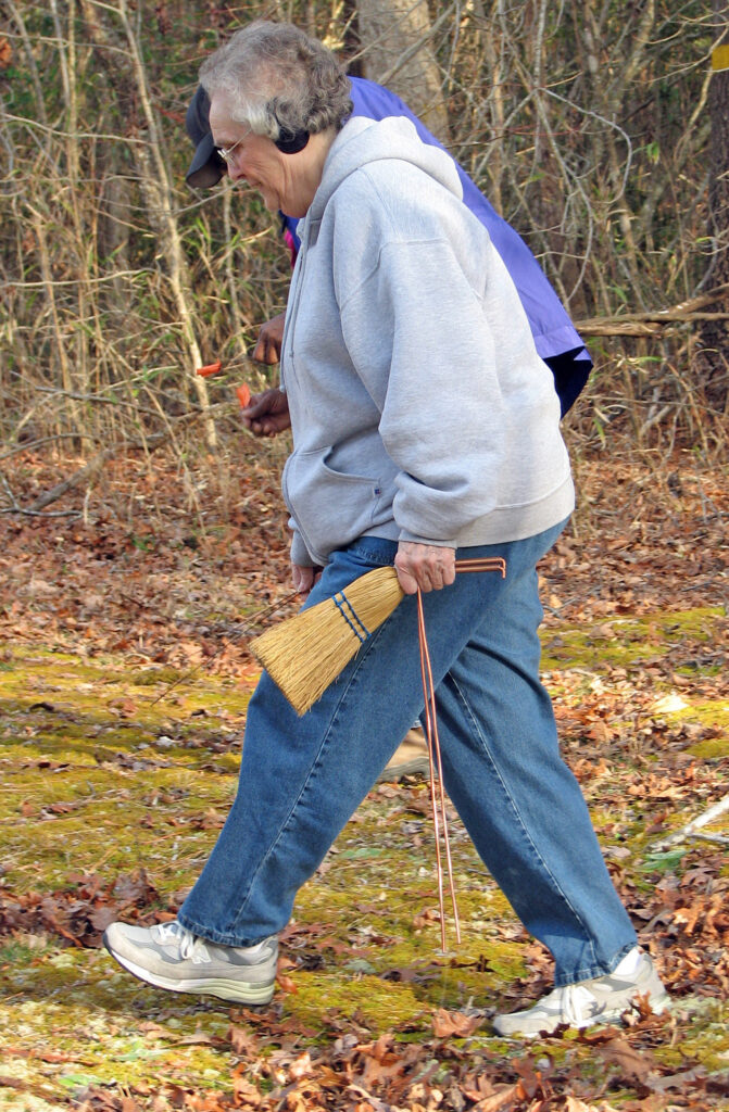 Louise helps survey a cemetery